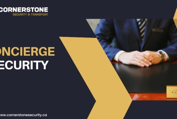 Concierge security professional seated at a front desk with nameplate, representing Cornerstone Security & Transport’s concierge services in Vancouver.